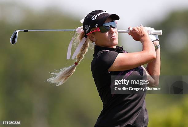 Natalie Gulbis watches her tee shot on the seventh hole during the third round of the 2013 U.S. Women's Open at Sebonack Golf Club on June 29, 2013...