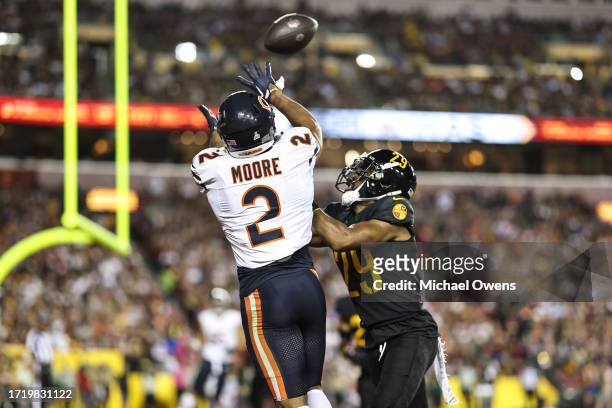 Moore of the Chicago Bears completes a pass for a touchdown against Kendall Fuller of the Washington Commanders during an NFL football game between...