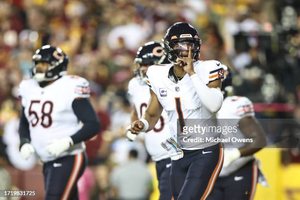 Justin Fields of the Chicago Bears celebrates after passing for a touchdown during an NFL football game between the Washington Commanders and the...