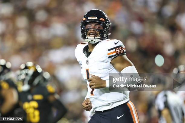 Justin Fields of the Chicago Bears celebrates after passing for a touchdown during an NFL football game between the Washington Commanders and the...