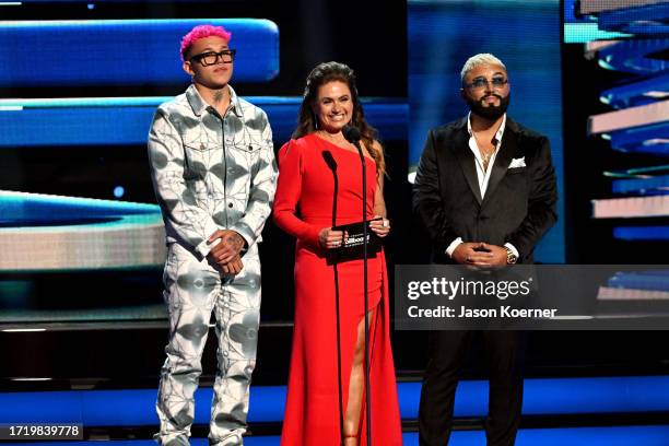 Beéle, Penélope Menchaca and Alex Sensation speak onstage during the 2023 Billboard Latin Music Awards at Watsco Center on October 05, 2023 in Coral...