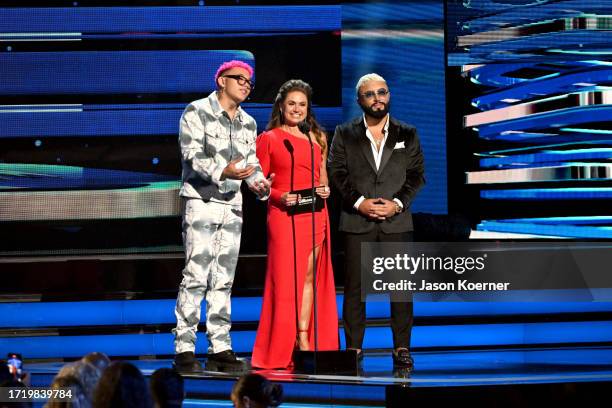 Beéle, Penélope Menchaca and Alex Sensation speak onstage during the 2023 Billboard Latin Music Awards at Watsco Center on October 05, 2023 in Coral...