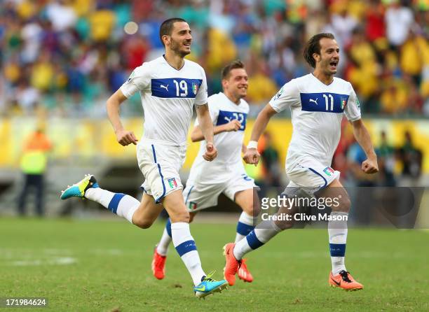 Leonardo Bonucci of Italy and Alberto Gilardino celebrate after Gianluigi Buffon of Italy saved the penalty of Walter Gargano of Uruguay to clinch...