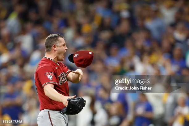 Paul Sewald of the Arizona Diamondbacks reacts after getting the last out and winning the Wildcard series over the Milwaukee Brewers during Game Two...