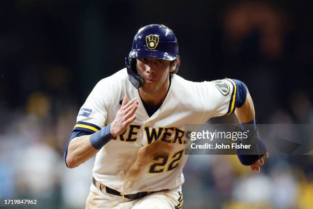 Christian Yelich of the Milwaukee Brewers runs toward third base against the Arizona Diamondbacks during Game Two of the Wild Card Series at American...