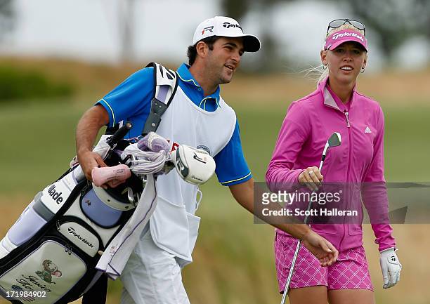 Jessica Korda walks with her boyfriend/caddie Johnny DelPrete during the final round of the 2013 U.S. Women's Open at Sebonack Golf Club on June 30,...
