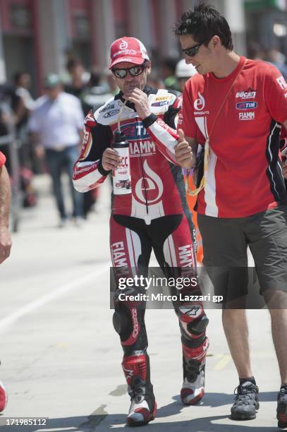 Carlos Checa of Spain and Team Ducati Alstare walks in the pit during race 1 of round seven of 2013 Superbike FIM World Championship at Enzo & Dino...