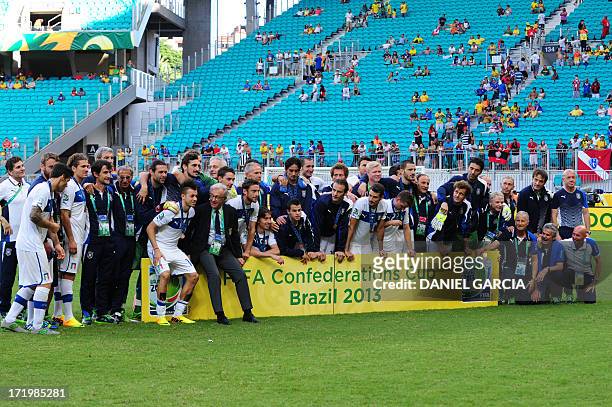 Italy's national football team poses for pictures after defeating Uruguay 3-2 in the penalty shoot-out of their FIFA Confederations Cup Brazil 2013...