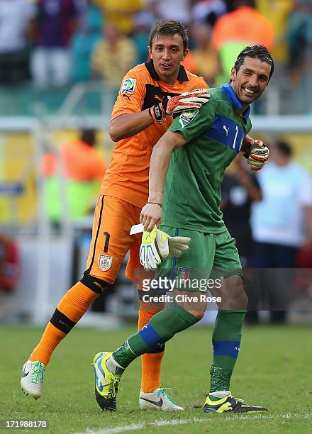 Gianluigi Buffon of Italy has a laugh with Fernando Muslera of Uruguay during a shootout during the FIFA Confederations Cup Brazil 2013 3rd Place...