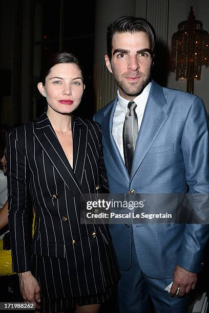 Delphine Chaneac and Zachary Quinto attend the Versace show as part of Paris Fashion Week Haute-Couture Fall/Winter 2013-2014 at on June 30, 2013 in...