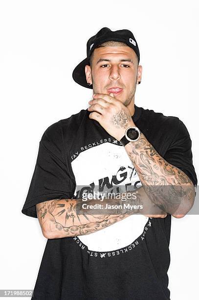 American Football Player and murder suspect Aaron Hernandez poses for a photo on March 10, 2012 in Palm Beach Gardens, Florida, USA.