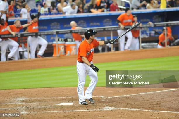 Jeff Mathis of the Miami Marlins hits a grand slam during the ninth inning against the San Diego Padres at Marlins Park on June 30, 2013 in Miami,...