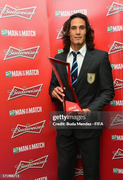 Edinson Cavani of Uruguay poses with the Man of the Match award after the FIFA Confederations Cup Brazil 2013 3rd Place match between Uruguay and...