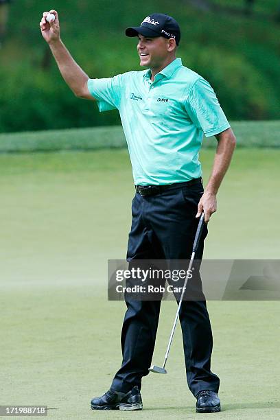 Bill Haas celebrates after putting out on the 18th green to win the AT&T National at Congressional Country Club on June 30, 2013 in Bethesda,...