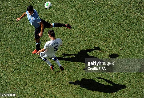 In this handout image provided by FIFA Luis Suarez of Uruguay competes with Mattia De Sciglio of Italy during the FIFA Confederations Cup Brazil 2013...