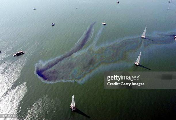 An oil slick is seen near oil rigs in the western Lake Maracaibo production areas in this undated aerial photo. Striking workers charge that the oil...
