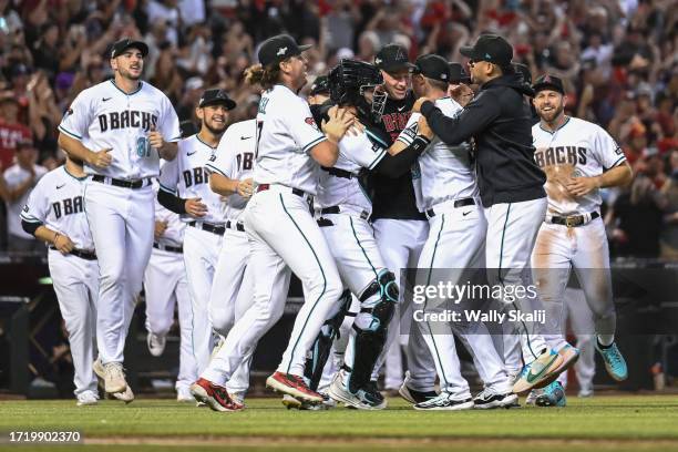 October 11: The Arizona Diamondback celebrate defeating the Los Angeles Dodgers in three games in the National League Division Series at Chase Field...