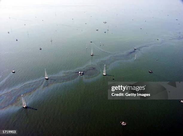 An oil slick is seen near oil rigs in the western Lake Maracaibo production areas in this undated aerial photo. Striking workers charge that the oil...