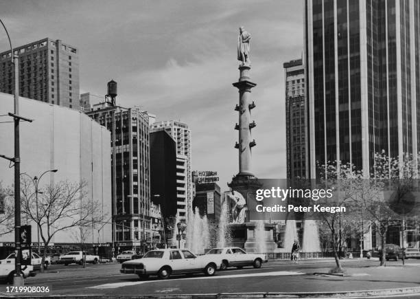 Traffic on Columbus Circle, Midtown Manhattan, New York City, New York, circa 1975. The traffic circle is named after the monument of Christopher...