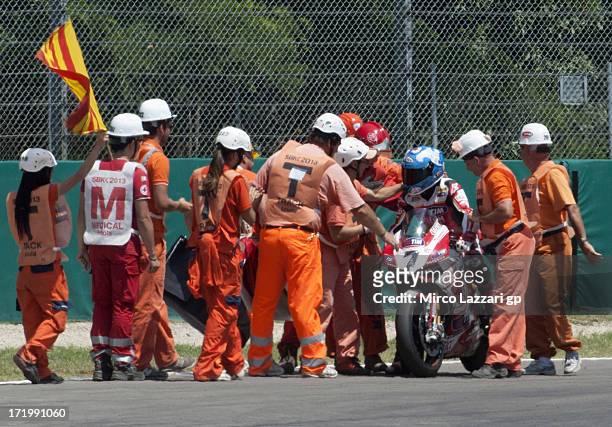 Carlos Checa of Spain and Team Ducati Alstare with marshalls during the race 1 of World Superbikes - Race during the round seven of 2013 Superbike...