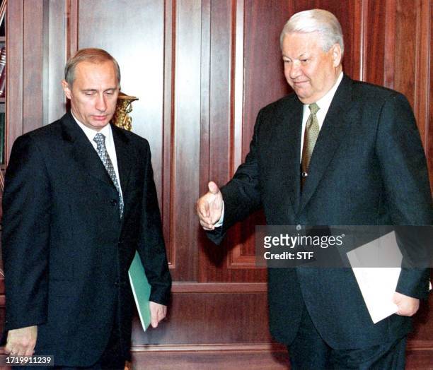 Russian President Boris Yeltsin invites Prime Minister Vladimir Putin to start the talks during their meeting in Moscow's Kremlin, on Tuesday 17...