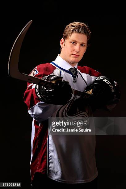 Nathan Mackinnon poses for a portrait after being selected number one over all in the first round by the Colorado Avalanche during the 2013 NHL Draft...