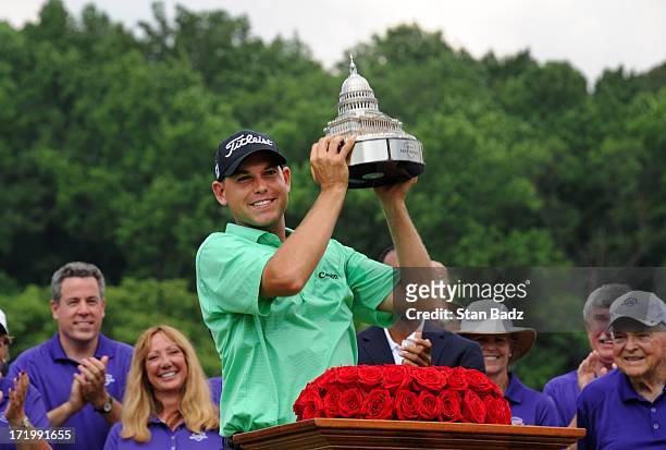 Bill Haas lifts the trophy after winning the AT&T National at Congressional Country Club on June 30, 2013 in Bethesda, Maryland.