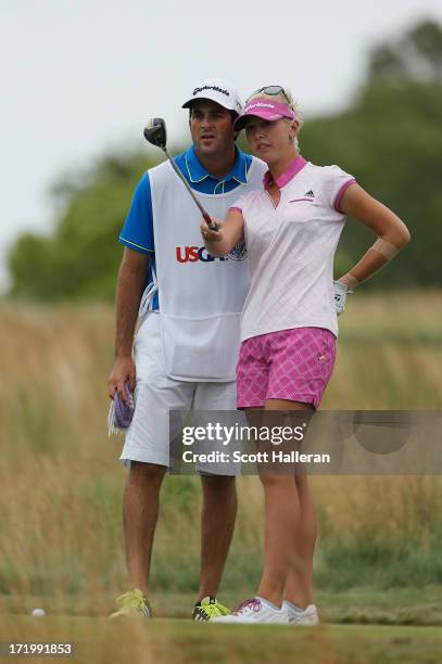 Jessica Korda lines up her tee shot on the 15th hole with her boyfriend/caddie Johnny DelPrete during the final round of the 2013 U.S. Women's Open...