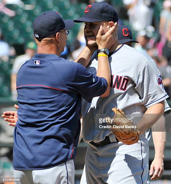Terry Francona of the Cleveland Indians congratulates Justin Masterson after the Indians victory against the Chicago White Sox on June 30, 2013 at...