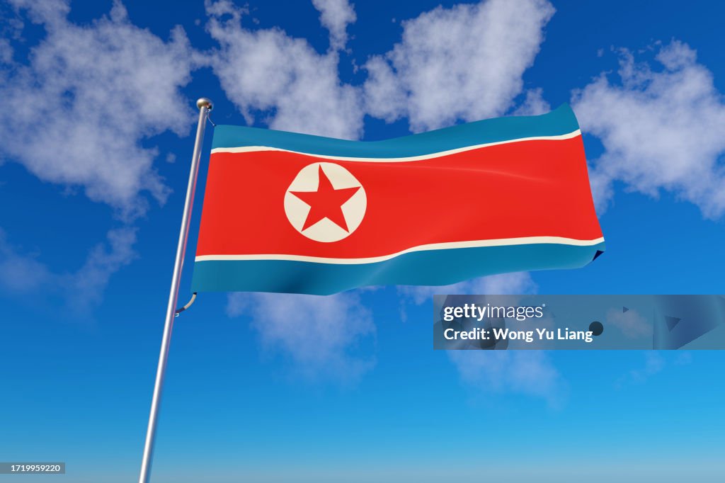 DPRK ( Democratic People's Republic of Korea ) North Korea's Flag with blue sky background