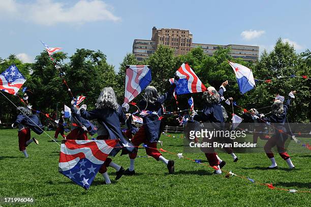 Actors dressed as Benjamin Franklin fly kites on June 29, 2013 in New York City. In honor of July 4th, Virgin Mobile enlisted 100 Benjamin Franklins...