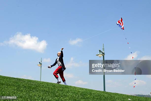 Actor dressed as Benjamin Franklin flies a kite on June 29, 2013 in New York City. In honor of July 4th, Virgin Mobile enlisted 100 Benjamin...