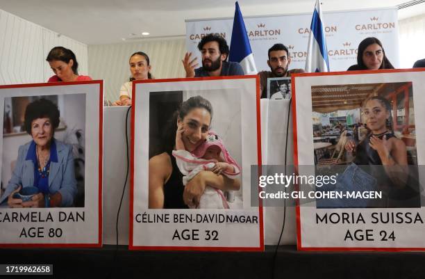 Relatives of missing French citizens in the aftermath of a surprise attack by Palestinian Hamas militants on communities in southern Israel, hold a...