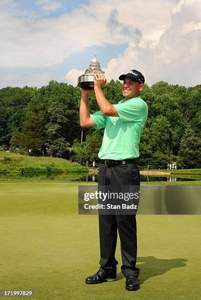 Bill Haas poses with the trophy after winning the AT&T National at Congressional Country Club on June 30, 2013 in Bethesda, Maryland.