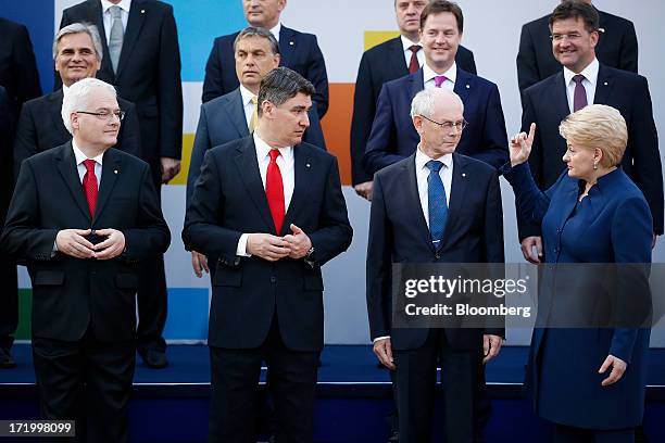 Left to right, front row, Ivo Josipovic, Croatia's president, Zoran Milanovic, Croatia's prime minister, Herman Van Rompuy, president of the European...