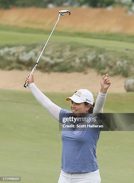 Inbee Park of South Korea celebrates on the 18th green after her four-stroke victory at the 2013 U.S. Women's Open at Sebonack Golf Club on June 30,...