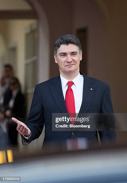 Zoran Milanovic, Croatia's prime minister, center, gestures as he waits to meet dignitaries ahead of a group photograph in St. Marks Square as part...