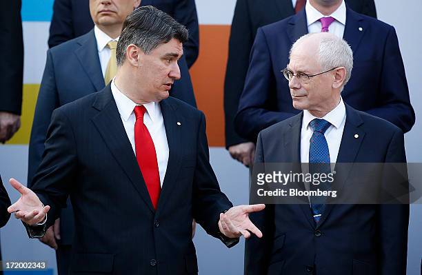 Zoran Milanovic, Croatia's prime minister, left, speaks with Herman Van Rompuy, president of the European Union , during a group photograph in St....