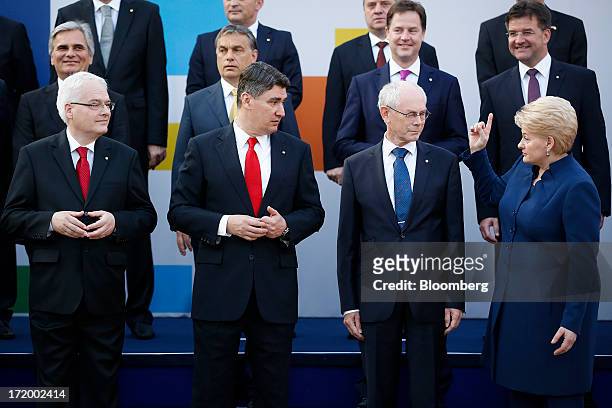 Left to right, front row, Ivo Josipovic, Croatia's president, Zoran Milanovic, Croatia's prime minister, Herman Van Rompuy, president of the European...