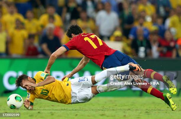 Alvaro Arbeloa of Spain tangles with Neymar of Brazil during the FIFA Confederations Cup Brazil 2013 Final match between Brazil and Spain at Maracana...