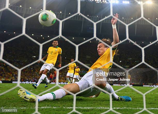 David Luiz of Brazil makes a goal-line clearance during the FIFA Confederations Cup Brazil 2013 Final match between Brazil and Spain at Maracana on...