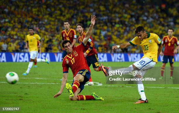 Neymar of Brazil scores his team's second goal to make the score 2-0 during the FIFA Confederations Cup Brazil 2013 Final match between Brazil and...