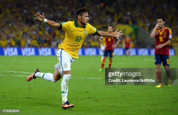 Neymar of Brazil celebrates scoring his team's second goal to make the score 2-0 during the FIFA Confederations Cup Brazil 2013 Final match between...