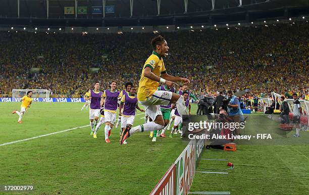 Neymar of Brazil celebrates scoring his team's second goal to make the score 2-0 during the FIFA Confederations Cup Brazil 2013 Final match between...