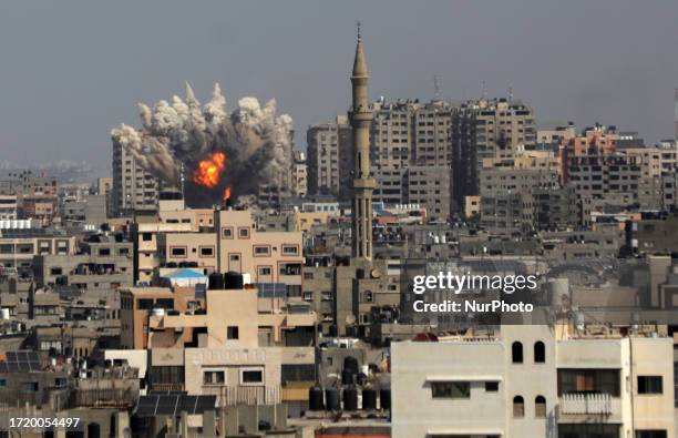 Smoke plumes billow during Israeli air strikes in Gaza City on October 12, 2023 as raging battles between Israel and the Hamas movement continue for...