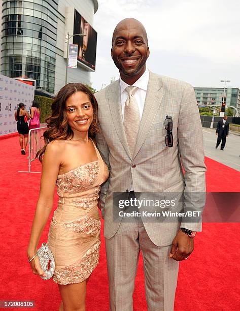 Former NBA player John Salley and wife Natasha Duffy attend the Ford Red Carpet at the 2013 BET Awards at Nokia Theatre L.A. Live on June 30, 2013 in...