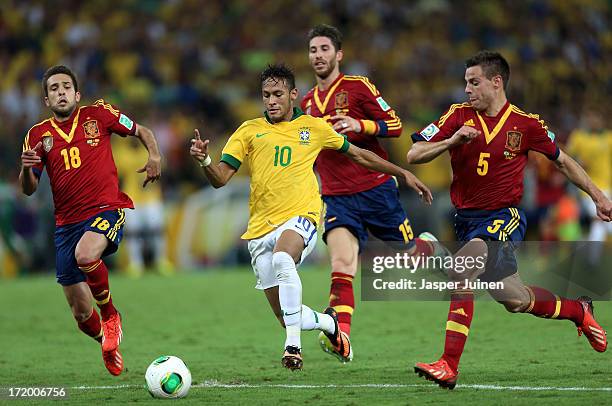 Neymar of Brazil is pursued by Jordi Alba , Sergio Ramos and Cesar Azpilicueta of Spain during the FIFA Confederations Cup Brazil 2013 Final match...