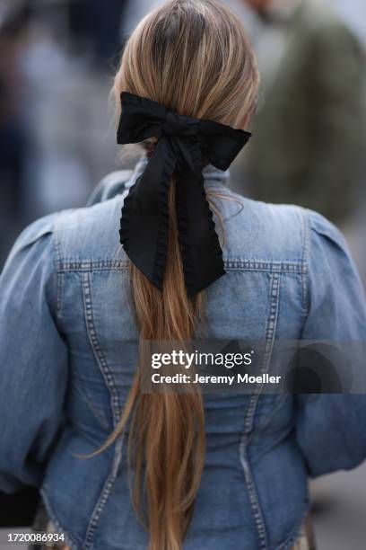 Guest is seen outside Zimmermann show wearing black sunnies, buttoned up denim jacket, mixed patterned maxi skirt, black Hermes Birkin handbag, black...