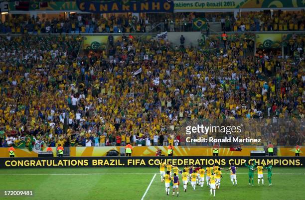 The Brazil players celebrate victory in front of their fans at the end of the FIFA Confederations Cup Brazil 2013 Final match between Brazil and...