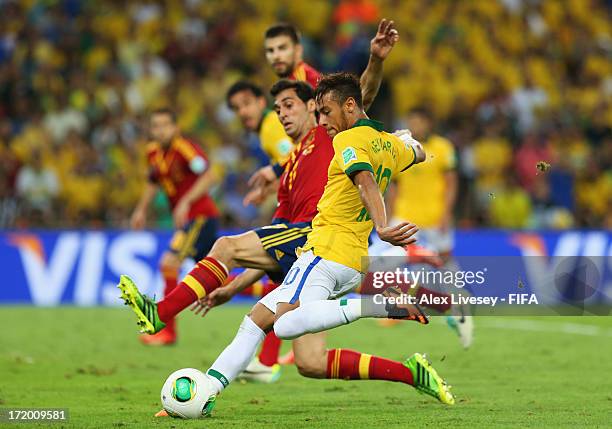 Neymar of Brazil scores his team's second goal during the FIFA Confederations Cup Brazil 2013 Final match between Brazil and Spain at Maracana on...